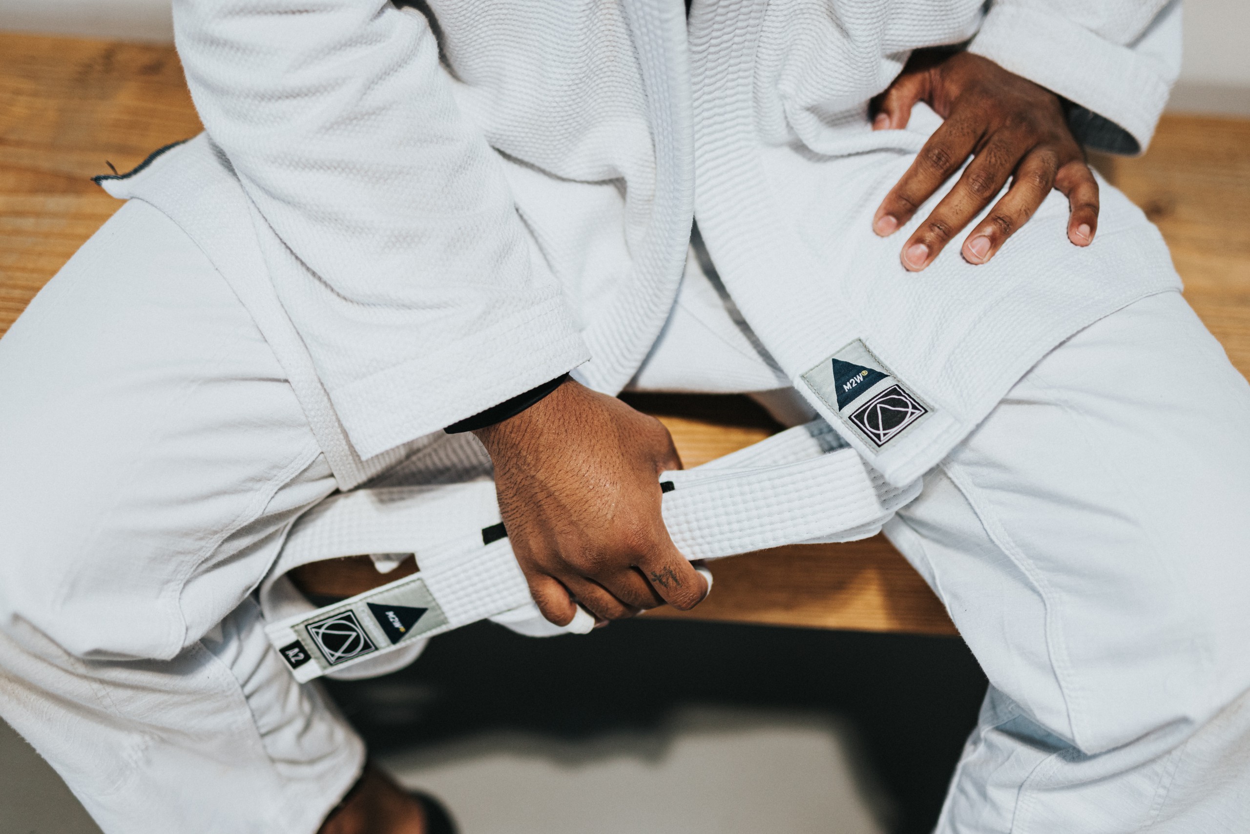 white belt competitor resting.